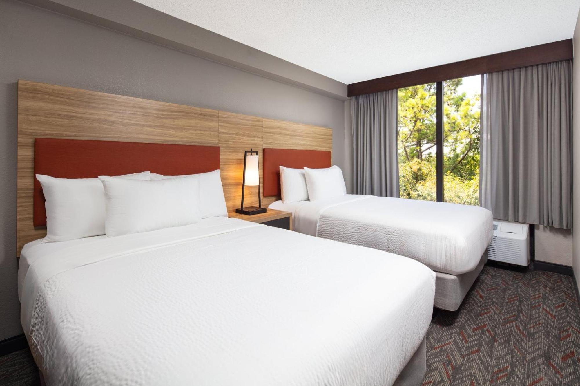 Studio Suite with Two Double Beds and Single Sofa Bed